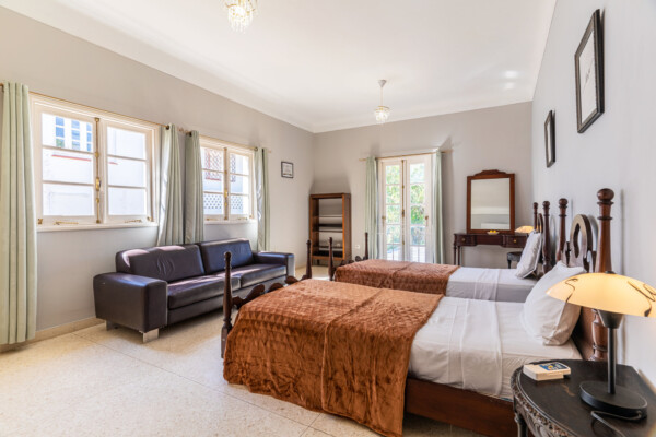 Anastasia Suite – Elegant bed, dressing table and seating area Miramar Residence – Room Anastasia bed and seating area