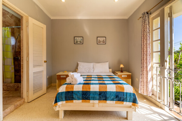 Timur Suite – Comfortable bed and bright windows Miramar Residence – Room Timur comfortable bed and bright windows