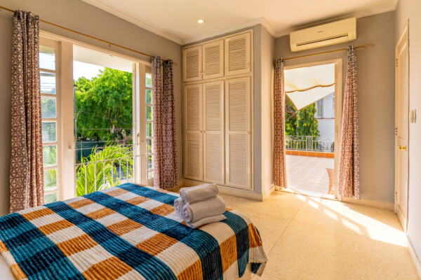 Timur Suite – Vintage furnishings, city/garden views and terrace Miramar Residence – Room Timur suite with shared terrace, Old Havana style large window and terrazzo floors