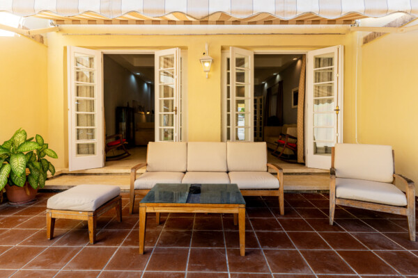 Patio – Sitting area under awning Miramar Residence – Patio awning with teak sitting area