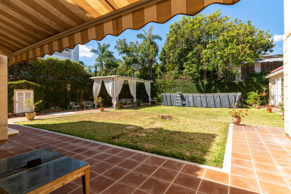 Patio – Large garden with several seating areas Miramar Residence – Patio with pergola, garden and seating